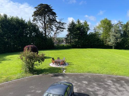 a car parked in a driveway next to a park at Glenmore House B&B Mullingar in Mullingar