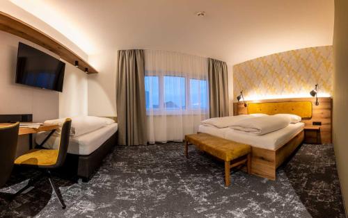 Vuode tai vuoteita majoituspaikassa Sleep in Premium Hotel Eggenburg