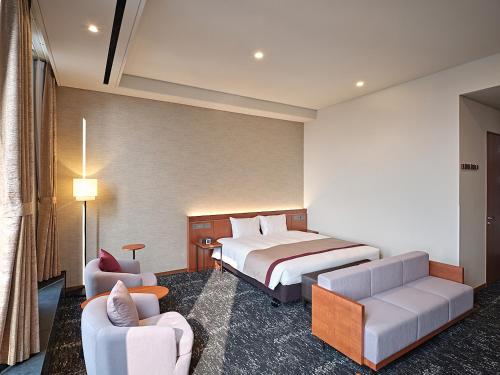 เตียงในห้องที่ Roynet Hotel Seoul Mapo