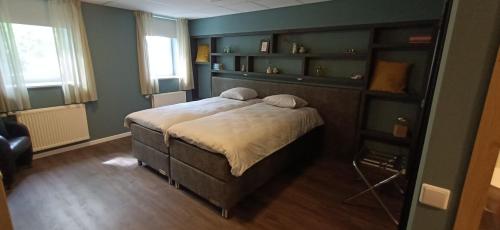 Postel nebo postele na pokoji v ubytování Boetiekhotel Lemmenhof