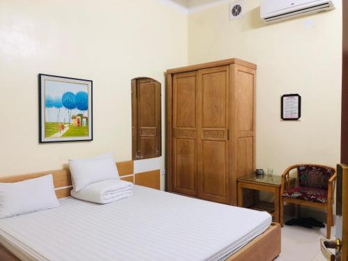 En eller flere senge i et værelse på Quốc Kiên hotel