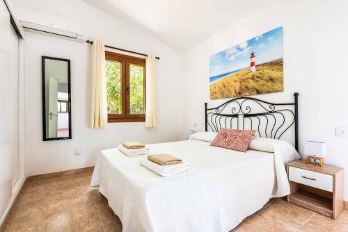 Säng eller sängar i ett rum på Villa Tramontana