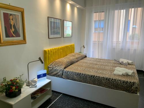 a bedroom with a bed and a window at House Sunflower by Holiday World in Arenzano