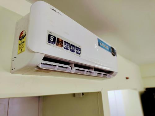 a close up of a machine in a room at Entire Studio Apt/Suite near Mall/Metro/ExpoMart in Noida