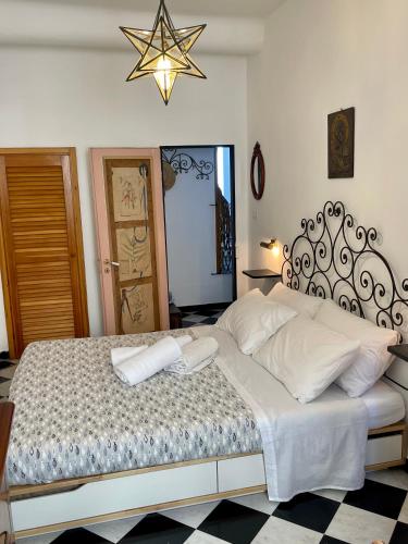a bedroom with a bed with two towels on it at La Lampara Camogli in Camogli