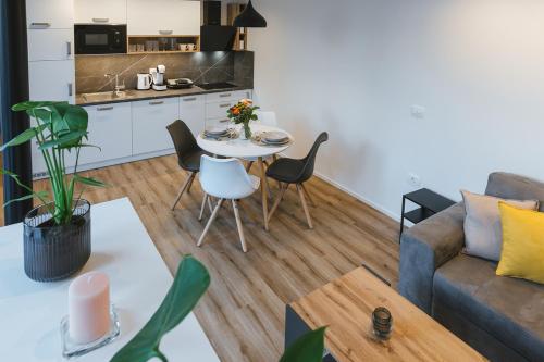 a living room with a couch and a table at Vila Rina in Bled