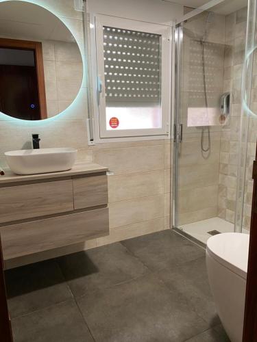 a bathroom with a sink and a shower at Casa Mar Roquetes in Roquetas