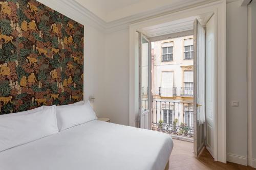 Llit o llits en una habitació de Be Mate Málaga Centro