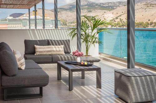 a living room with a view of the water at The Twelve Suites Collection in Argostoli
