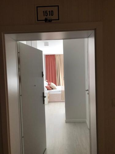 Ένα ή περισσότερα κρεβάτια σε δωμάτιο στο Rogowo Pearl 1510