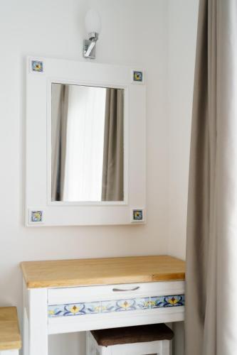 a bathroom vanity with a mirror and a sink at Costa Sariyaz Hotel Bodrum in Bodrum City