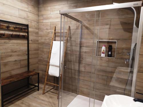 a shower with a glass door in a bathroom at Apartamento con encanto "ZIRIMIRI" in Bermeo