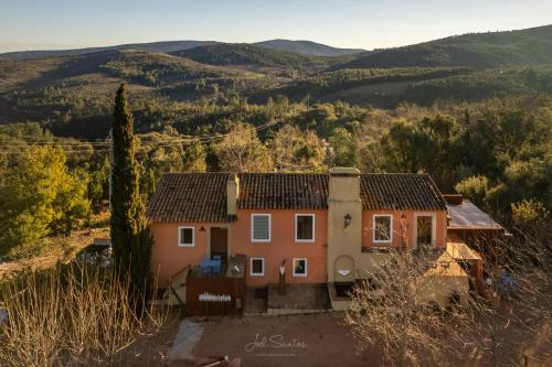 a house with a view of the mountains at Barrieiro - Art & Nature in Marvão