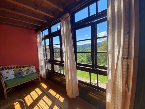 a room with a large window with a view at Casa Rural El Bohío CA-846-AS in Arriondas