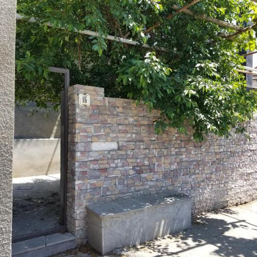 a brick wall with a sign on it at Maria in Yerevan