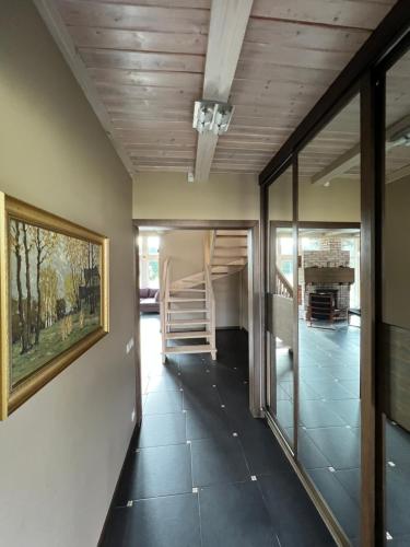 a hallway of a house with a wooden ceiling at Stella in Ziemupe