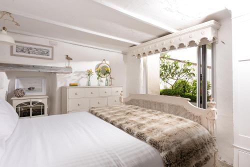 سرير أو أسرّة في غرفة في Carvossa, Marazion