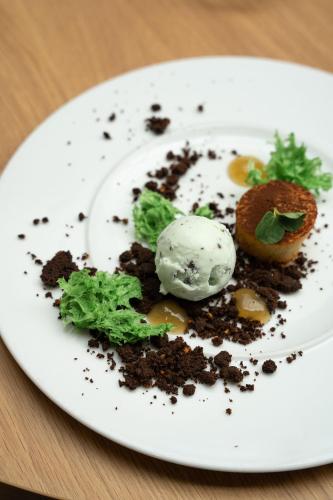 a plate of food with an ice cream on it at Holiday Inn Lyon Vaise by IHG in Tassin-la-Demi-Lune