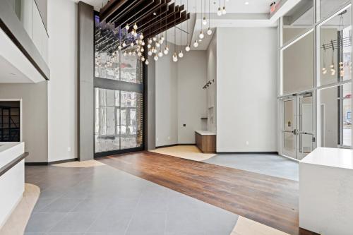 a large room with white walls and wood floors at WhyHotel by Placemakr, Alexandria in Alexandria