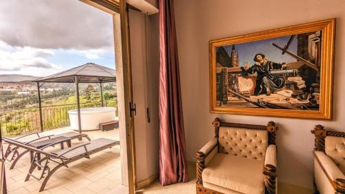 a living room with a painting on the wall at Arts Club Suite & Spa in Chianciano Terme