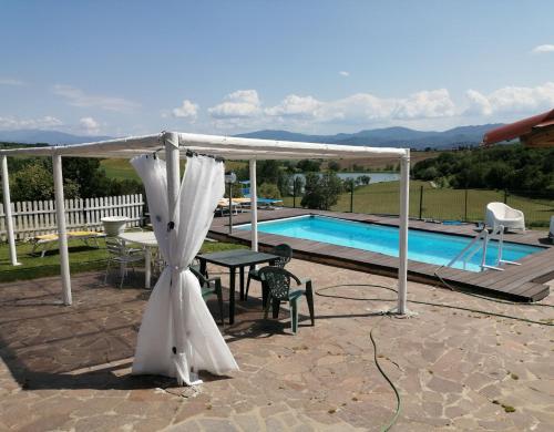 a wedding tent and a table and a pool at Il Marrondindo Bed & Breakfast in Galliano