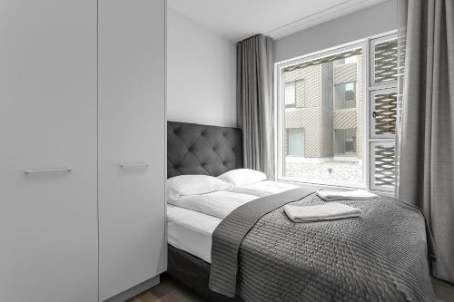 Postel nebo postele na pokoji v ubytování Modern Apt in Central Reykjavík