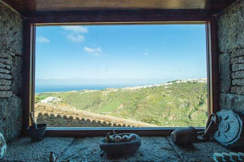 a window in a room with a view of the ocean at Mountain Hideaway House in Moya in Moya