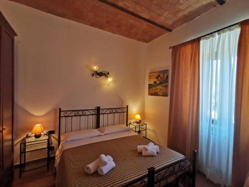 Postel nebo postele na pokoji v ubytování Saturnia Residence