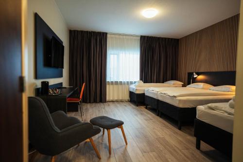 Postel nebo postele na pokoji v ubytování Konvin Hotel by Reykjavik Keflavik Airport