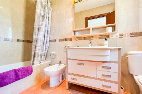a bathroom with a sink and a toilet and a shower at Villa Son Sala Nou in Campos