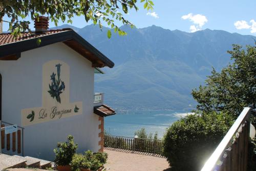 a building with a view of a body of water at Hotel Panorama e Residence in Tremosine Sul Garda