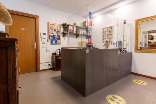 a large room with a counter and a door at Affittacamere Valentina in Orvieto