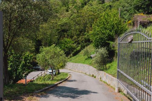 a road with a fence on the side of a hill at La Quiete in Genova