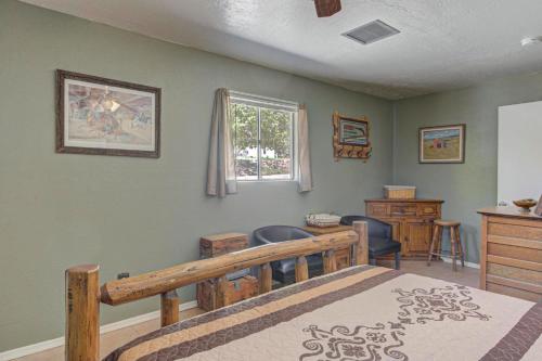 a bedroom with a bed and a desk and a window at Pine Cabin in Pine