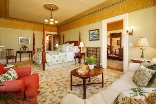 a hotel room with a bed and a living room at The Lady Mary Inn in North Berwick