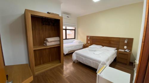 A bed or beds in a room at La Torre Jaguarão