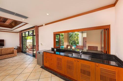 a kitchen with a sink and a counter top at Villa Hoata| Luxury 2BR villa in the Baan Bua Estate | Nai Harn beach in Nai Harn Beach