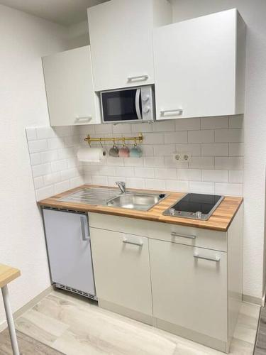Kuchyň nebo kuchyňský kout v ubytování Little sweet appartment
