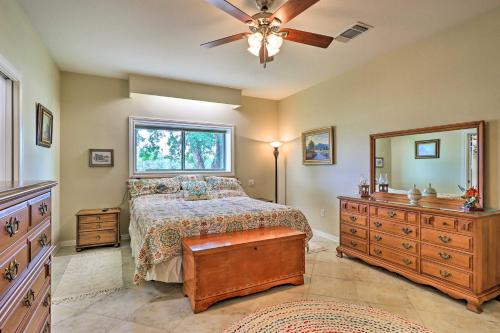 Un dormitorio con una cama, una cómoda y un espejo. en Bertram Ranch Property with Patio and Gas Grill!, en Bertram