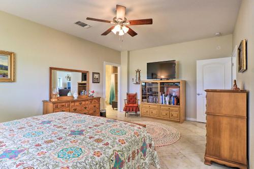 a bedroom with a bed and a ceiling fan at Bertram Ranch Property with Patio and Gas Grill! in Bertram