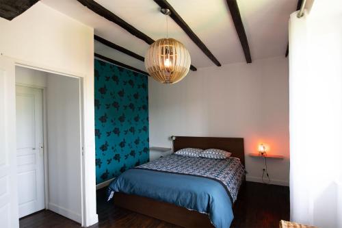 Postel nebo postele na pokoji v ubytování La Petite Ecole