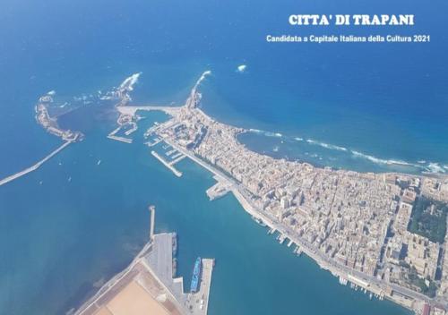 an aerial view of a city and the water at Sunset in Trapani