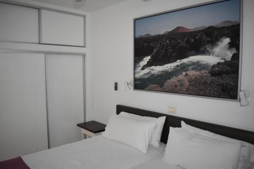 Ένα ή περισσότερα κρεβάτια σε δωμάτιο στο Apartamentos Mayagüez - Adults Only