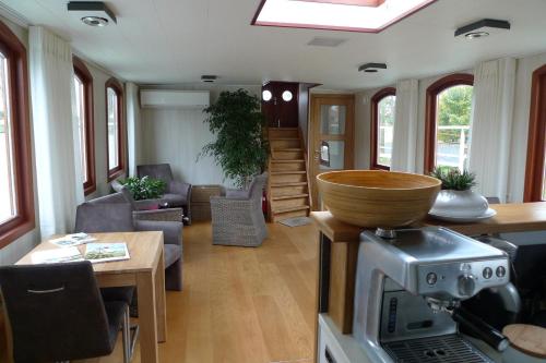 a living room with a bowl on top of a train at B&B Barge Johanna in Bruges
