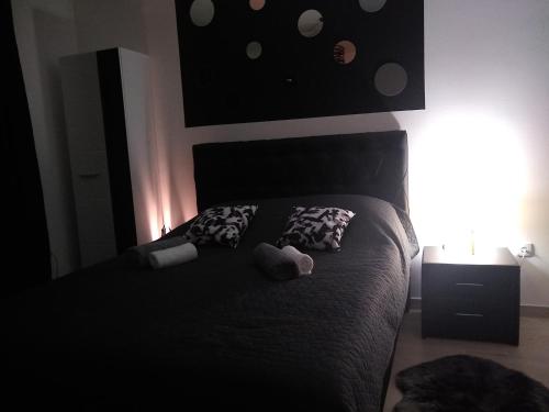 a bedroom with a bed with two teddy bears on it at Apartman_Park in Smederevska Palanka