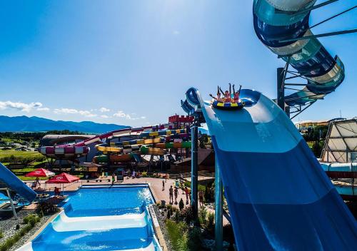 a large water park with a roller coaster at Chata 107 Tatralandia Village in Liptovský Mikuláš