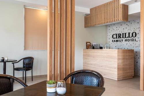 a dining room with a table and chairs at Cirillo Family Hotel-Christinas Studios in Mastihari