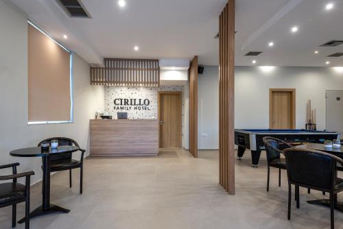 a restaurant with tables and a pool table at Cirillo Family Hotel-Christinas Studios in Mastihari