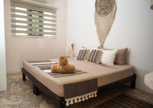 Ένα ή περισσότερα κρεβάτια σε δωμάτιο στο Villa Los Mangles Boutique Hotel