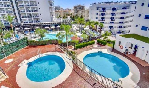Výhled na bazén z ubytování Apartamento con parking con piscina junto a la playa nebo okolí